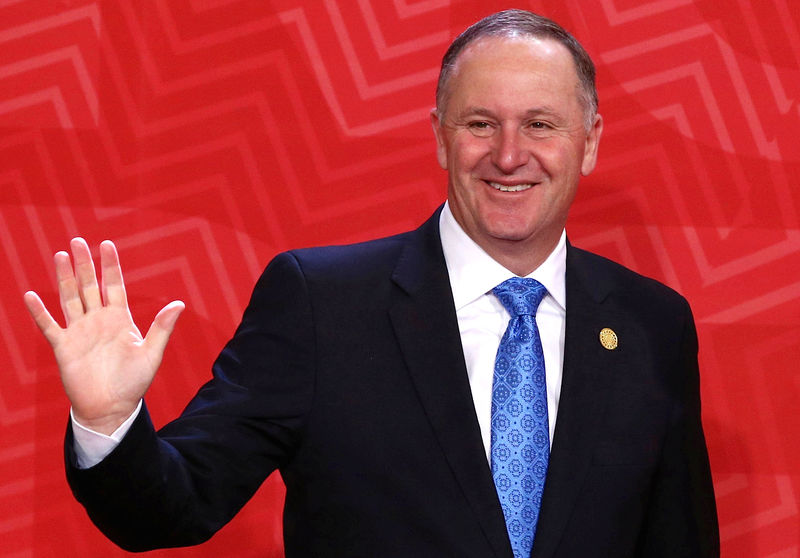 © Reuters. File photo of New Zealand's Prime Minister John Key waveing to photographers during the APEC Summit in Lima, Peru