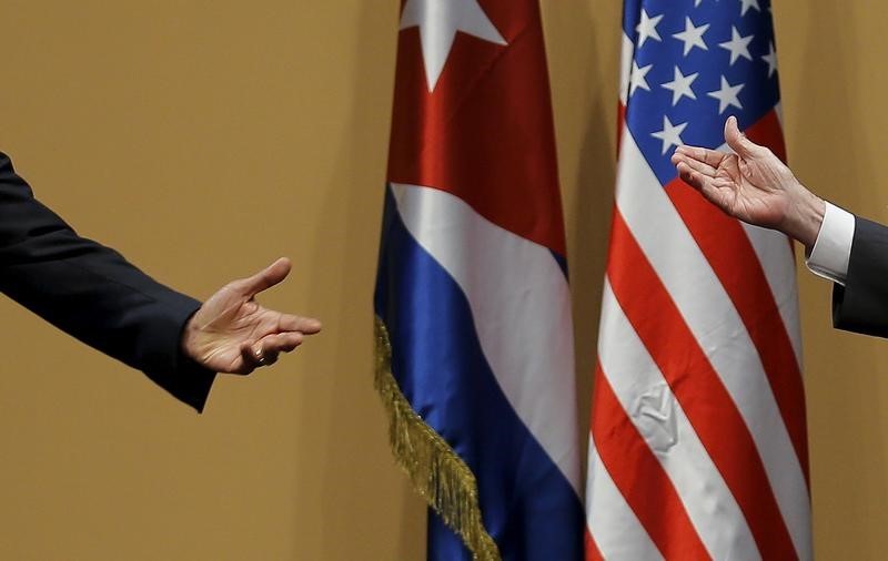 © Reuters. The hands of U.S. President Barack Obama and Cuban President Raul Castro are seen during a news conference as part of Obama's three-day visit to Cuba, in Havana