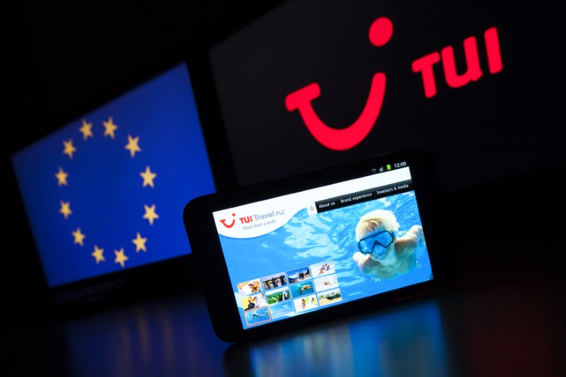 © Reuters. The website of German tourism group TUI AG, owner of Europe's largest travel company TUI Travel, is pictured on a mobile phone in this illustration picture taken in Lavigny