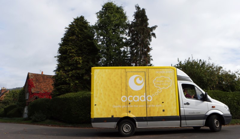 © Reuters. An Ocado delivery truck drives through Fingest in southern England
