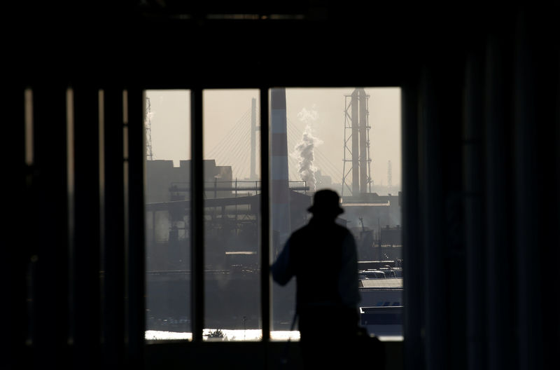 © Reuters. Chimneys of an industrial complex are seen from an observatory deck at an industrial port in Kawasaki