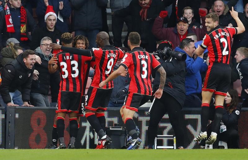 © Reuters. Bournemouth's Nathan Ake celebrates scoring their fourth goal with teammates