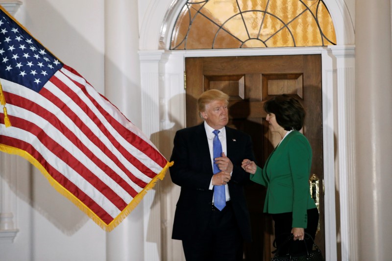 © Reuters. U.S. President-elect Donald Trump appears with Cathy McMorris Rodgers outside the main clubhouse after their meeting at Trump National Golf Club in Bedminster