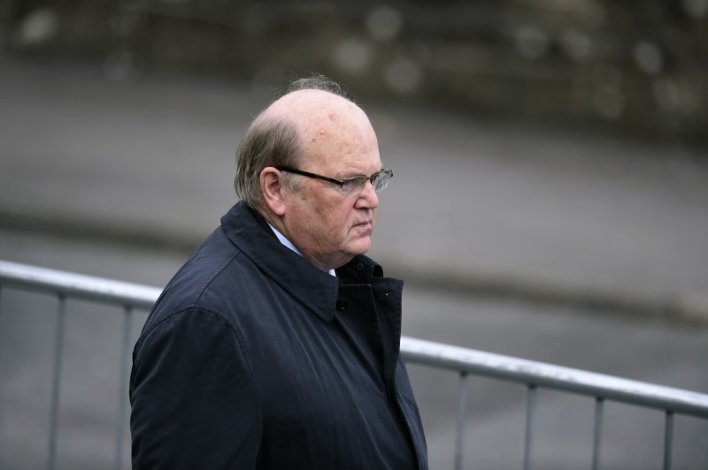 © Reuters. Irish Minister for Finance Michael Noonan arrives for the funeral service of Munster rugby coach Anthony Foley at St. Flannan's Church in Killaloe