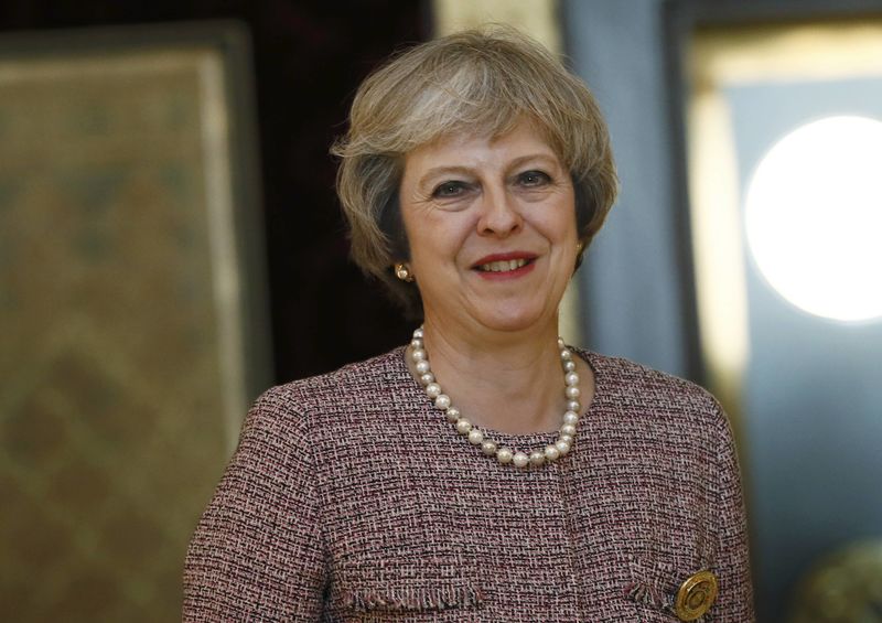 © Reuters. Britain's Prime Minister Theresa May smiles as she meets the King of Bahrain King Hamad Bin Isa Khalifa in Manama