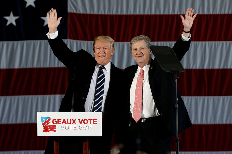 © Reuters. File photo of U.S. President-elect Donald Trump waving with U.S. Senate Candidate from Louisiana John Kennedy during a "Thank You USA" tour rally in Baton Rouge