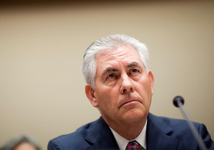 © Reuters. Tillerson, chairman and CEO of ExxonMobil, testifies about the company's acquisition of XTO Energy before the House Energy and Environment Subcommittee on Capitol Hill in Washington