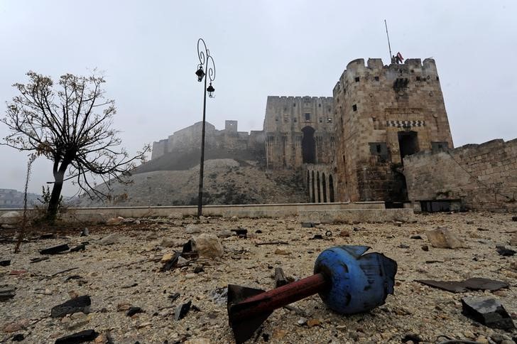 © Reuters. The remains of a shell are pictured outside Aleppo's historic citadel