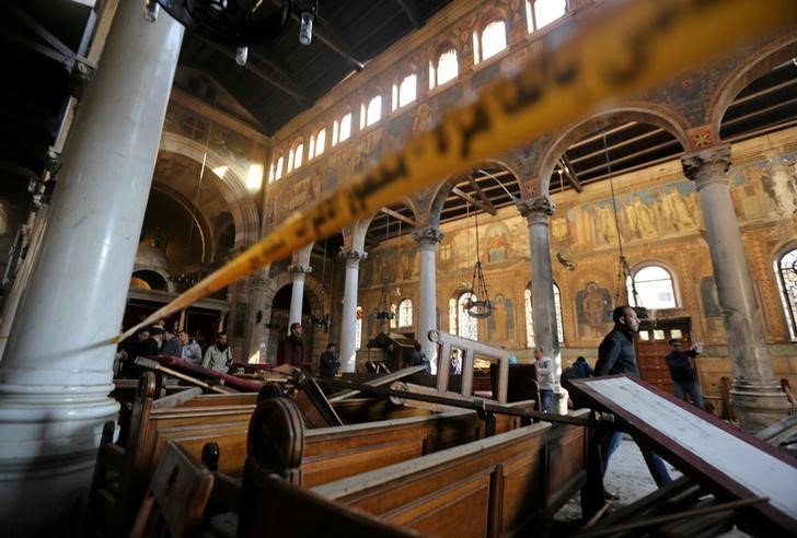 © Reuters. Damage from the explosion inside Cairo's Coptic Orthodox Cathedral is seen inside the cathedral in Cairo