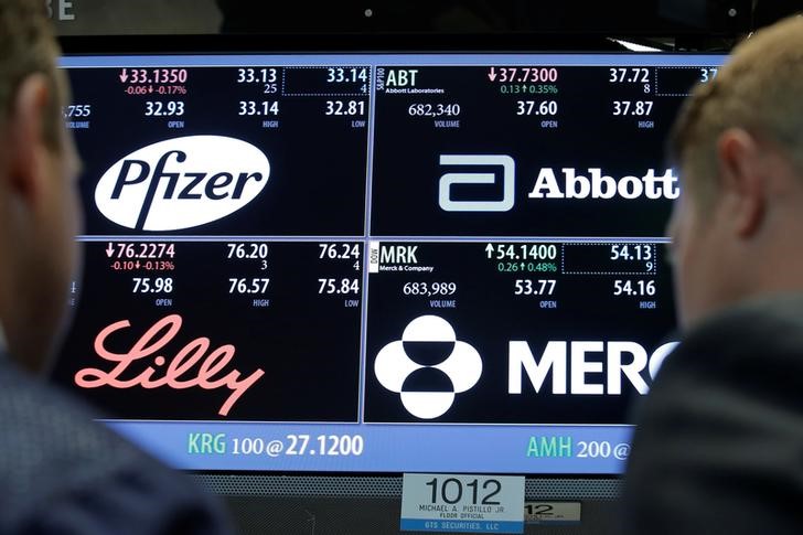 © Reuters. A screen displays trading information for Pfizer, Abbott Laboratories, Merck and Eli Lilly and Company on the floorof the NYSE