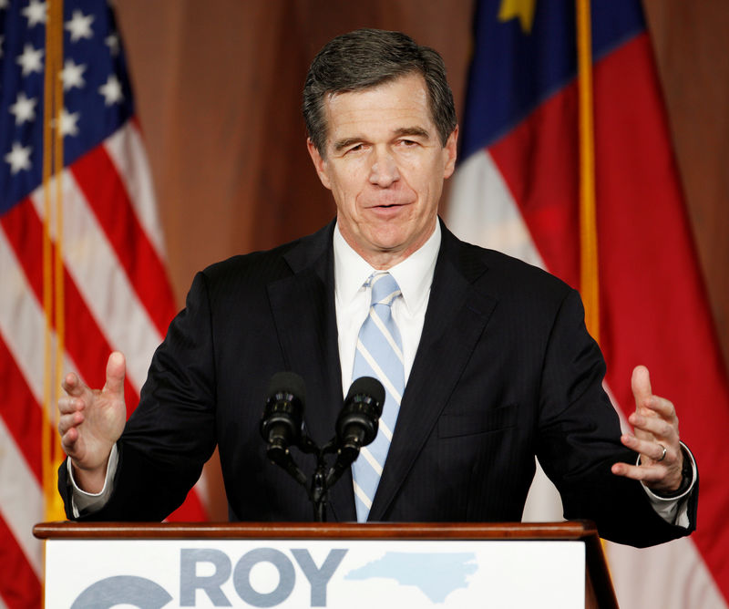 © Reuters. File photo of North Carolina Governor-elect Roy Cooper speaking to supporters at a victory rally in Raleigh