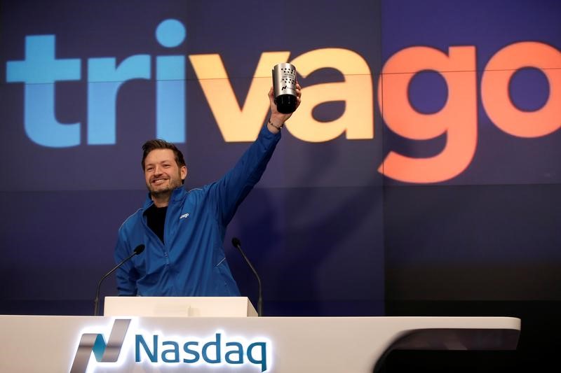 © Reuters. Trivago co-founder and CEO Rolf Schromgens celebrates before ringing the opening bell on the Nasdaq  Stock Market as Trivago, the hotel search platform, was listed during an initial public offering in New York