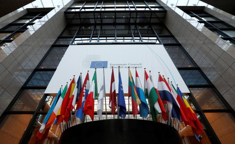 © Reuters. Flags are seen inside the European Council headquarters on the eve of a EU Summit in Brussels