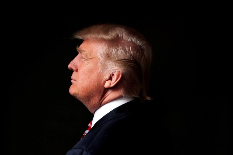 © Reuters. FILE PHOTO: Republican U.S. presidential candidate Donald Trump poses for a photo after an interview with Reuters in his office in Trump Tower