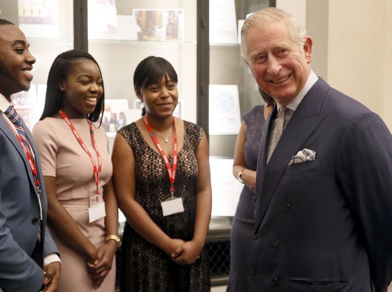 © Reuters. Britain's Prince Charles meets people on a Scholarship programme during a visit to the Bank in London