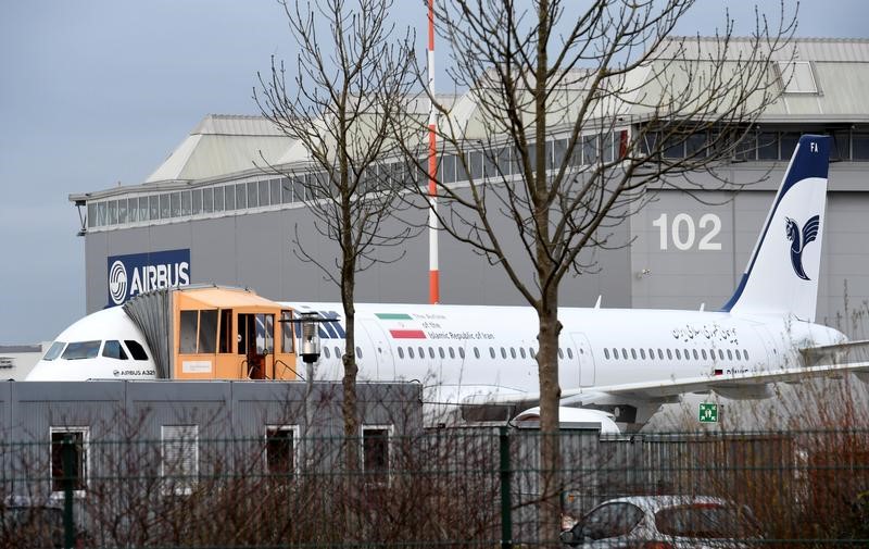 © Reuters. An Airbus A321 with the Iranian flag and description "The airline of the Islamic Republic of Iran" is parked at the Airbus facility in Hamburg