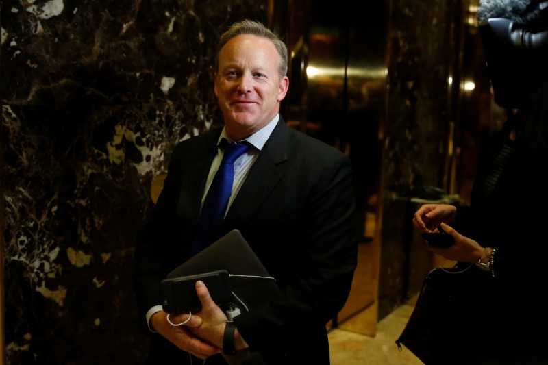 © Reuters. Chief Strategist & Communications Director for the Republican National Committee Sean Spicer arrives in the lobby of Republican president-elect Donald Trump's Trump Tower in New York