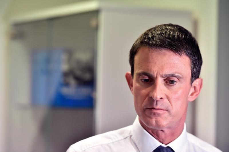 © Reuters. French politician Manuel Valls, candidate for January's Socialist presidential primary, is seen after the inauguration of his campaign headquarters in Paris