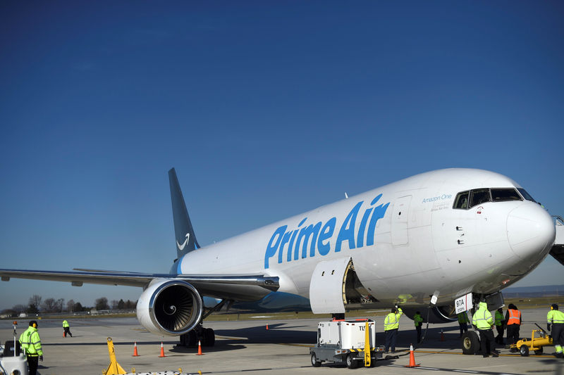 © Reuters. A wide body aircraft emblazoned with Amazon's Prime logo is unloaded at Lehigh Valley International Airport in Allentown, Pennsylvania, U.S.