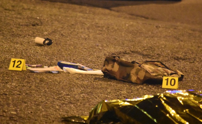 © Reuters. Objects belonging to Anis Amri, the suspect in the Berlin Christmas market truck attack, are seen next to his body in a suburb of the northern Italian city of Milan