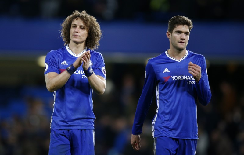 © Reuters. Chelsea's David Luiz and Marcos Alonso after the match