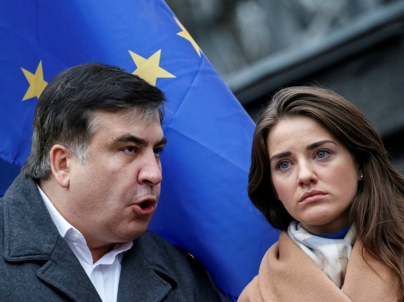 © Reuters. Former Georgian President and former governor of Odessa region Saakashvili and former head of the customs office at the port of Odessa Marushevska attend an anti-government rally in Kiev