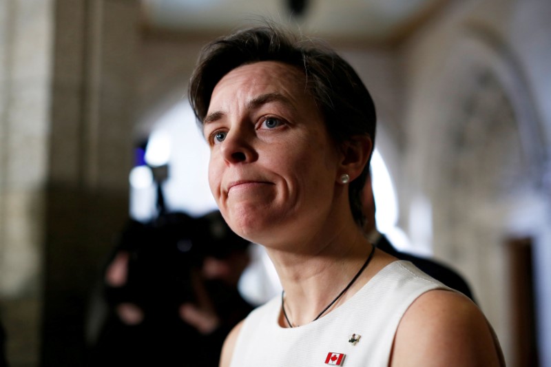 © Reuters. FILE PHOTO --  Canada's then-Labour Minister Leitch pauses while speaking to journalists on Parliament Hill in Ottawa