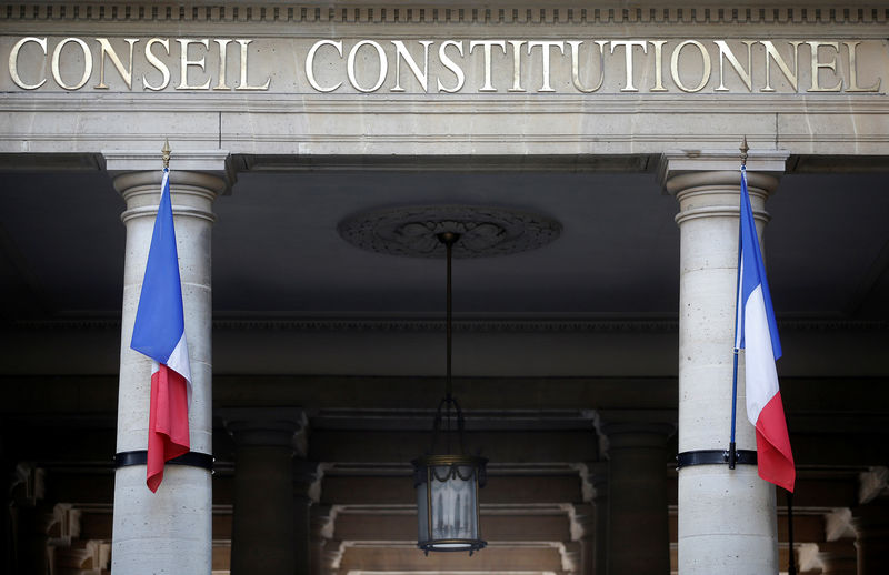 © Reuters. File photo shows French flags that hang outside the entrance of the Constitutional Council in Paris