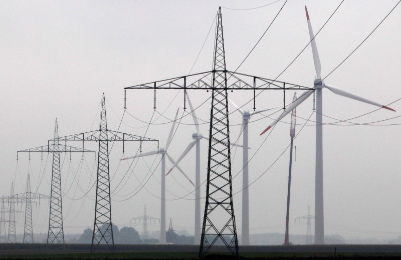 © Reuters. Maintenance work is done on a Vestas wind turbine at a wind energy park near Heide