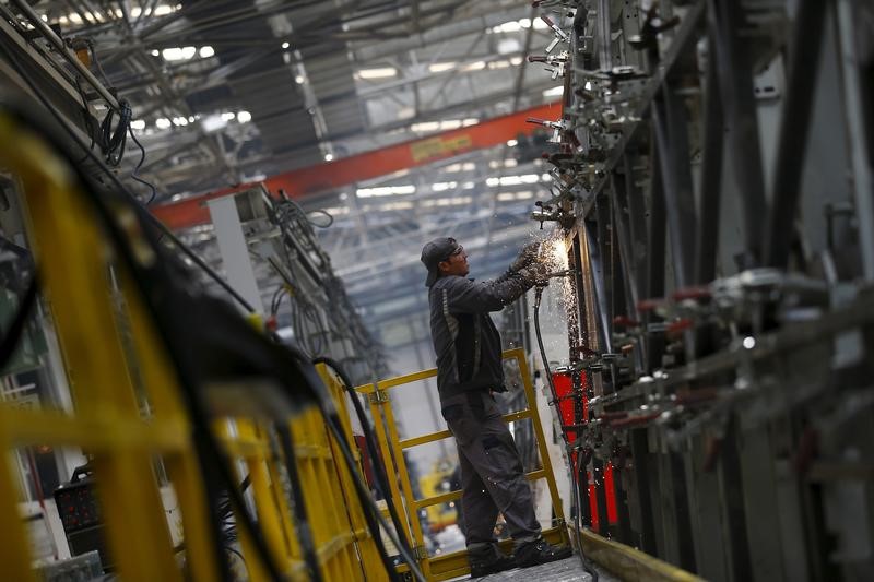 © Reuters. A man works work at the assembly line of the MAN Bus Production Center in Ankara