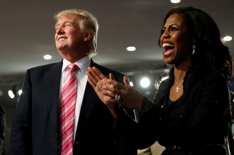 © Reuters. Republican presidential nominee Donald Trump and Omarosa Manigault (R) attend a church service, in Detroit, Michigan