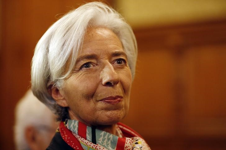 © Reuters. Managing Director of the International Monetary Fund Christine Lagarde reacts before the start of her trial about a state payout in 2008 to a French businessman, at the courts in Paris