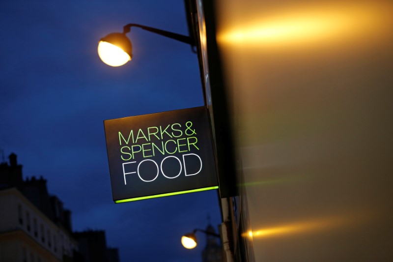 © Reuters. A Marks & Spencer logo is seen in front of one of their food stores in Paris