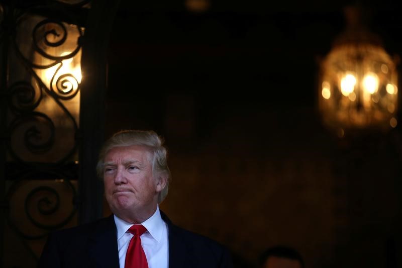 © Reuters. U.S. President-elect Donald Trump pauses as he talks to members of the media after a meeting with Pentagon officials at Mar-a-Lago estate in Palm Beach