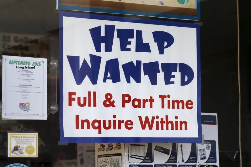 © Reuters. An advertisement for job openings is seen outside a store  in Port Washington, New York
