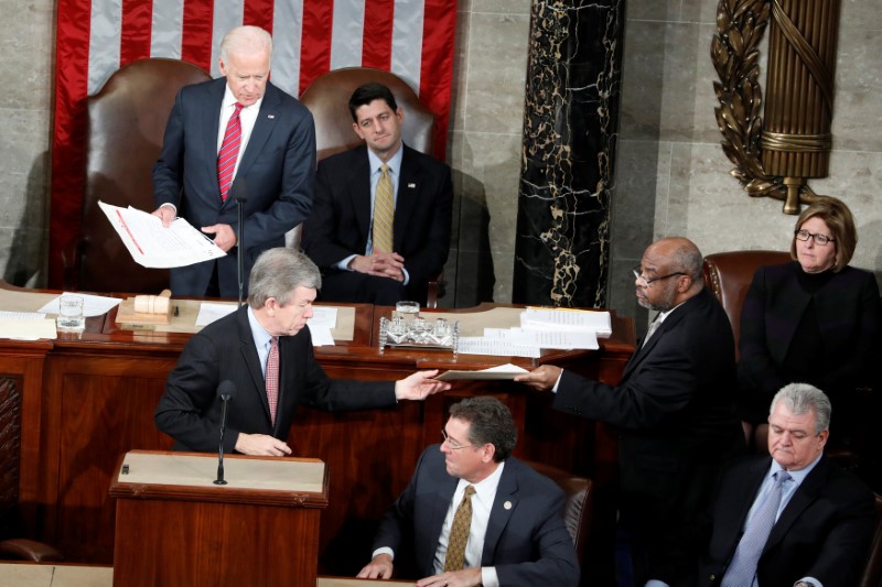 © Reuters. U.S. Vice President Joe Biden and Speaker of the House Paul Ryan preside over a joint session of Congress to count Electoral Votes, in Washington