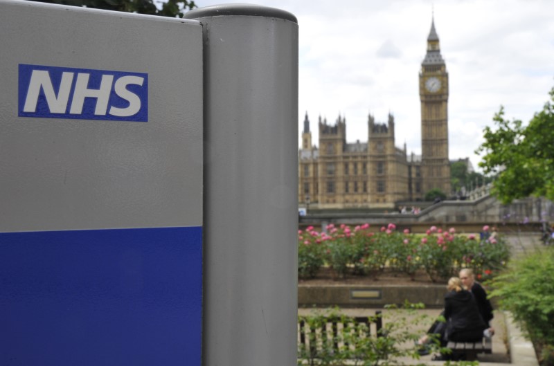 © Reuters. A NHS sign is seen in the grounds of St Thomas' Hospital in London