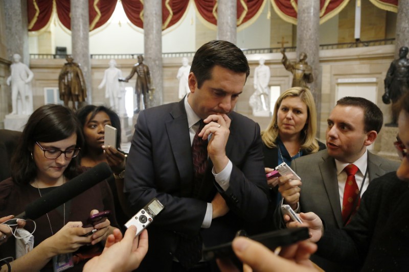 © Reuters. Nunes talks to reporters as he walks from Boehner's offices at the U.S. Capitol in Washington