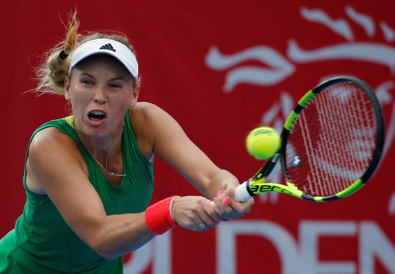 © Reuters. Tennis - Hong Kong Open final - Caroline Wozniacki of Denmark v Kristina Mladenovic of France