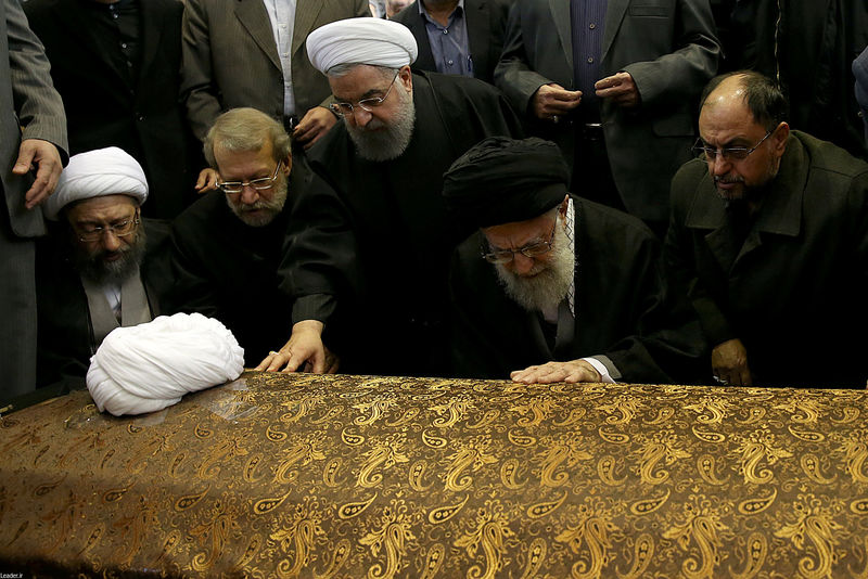 © Reuters. Iran's Supreme Leader Ayatollah Ali Khamenei and Iran's President Hassan Rouhani touch the coffin of former president Ali Akbar Hashemi Rafsanjani during his funeral ceremony in Tehran