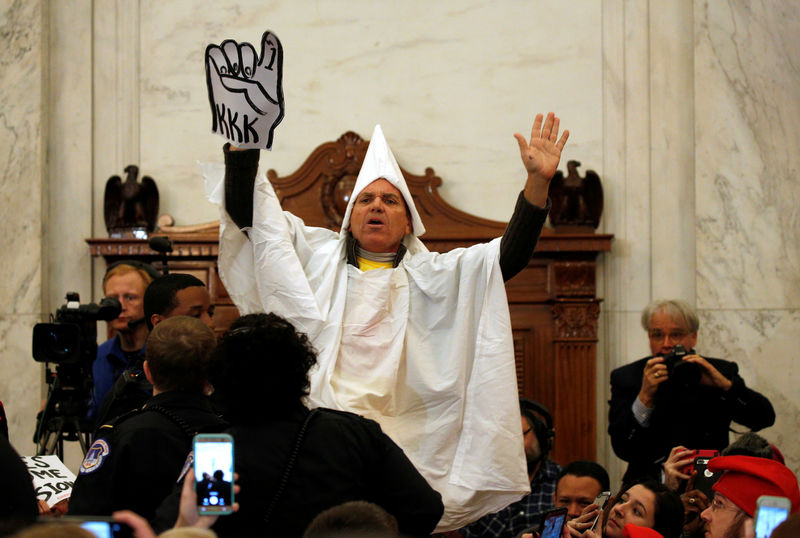 © Reuters. Protesters at Sessions confirmation hearing to become U.S. attorney general