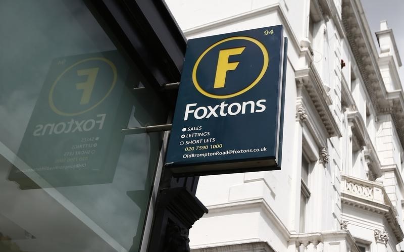 © Reuters. A Foxtons estate agent sign is seen outside a branch in west London