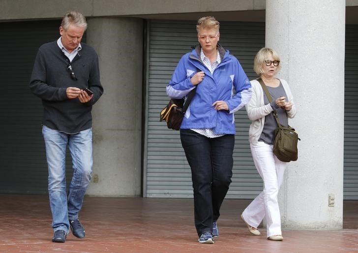 © Reuters. Friends and family of Volkswagen executive Oliver Schmidt, who was arrested on charges of conspiracy to defraud the United States in connection with the automaker's emissions cheating scandal