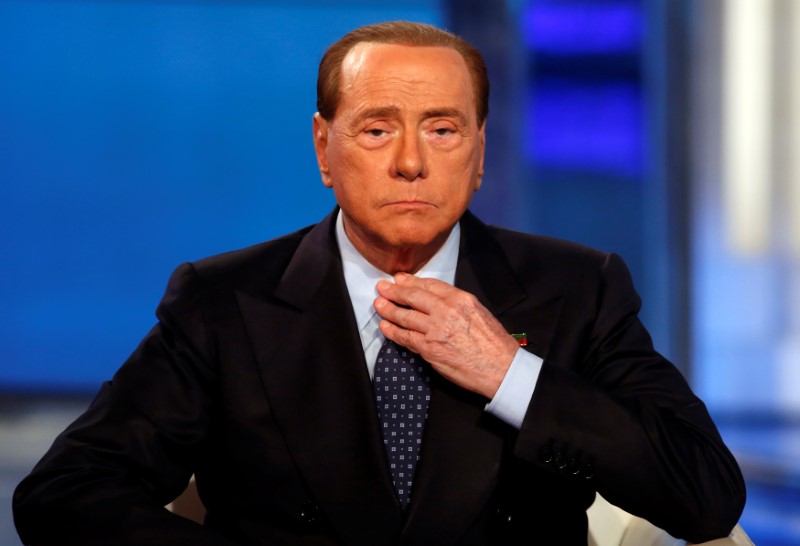 © Reuters. Italy's former PM Berlusconi attends television talk show "Porta a Porta" (Door to Door) in Rome