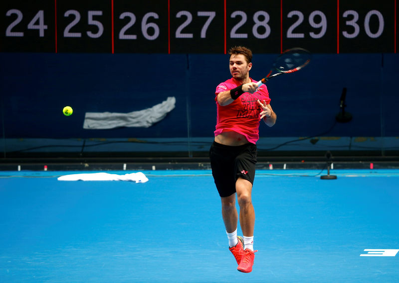 © Reuters. Switzerland's Stan Wawrinka hits a shot during a training session on Rod Laver Arena ahead of the Australian Open tennis tournament in Melbourne, Australia