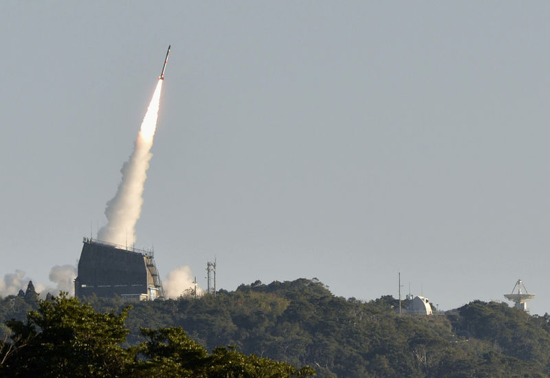 © Reuters. Japan Aerospace Exploration Agency's SS-520 satellite launches at its Uchinoura Space Center in Kimotsuki