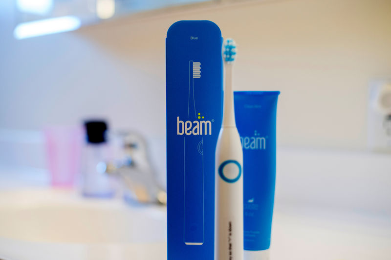 © Reuters. A Beam toothbrush and toothpaste stand on a vanity at Scott Ozawa's home in Belmont