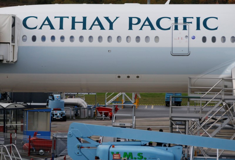 © Reuters. A passenger plane of Cathay Pacific Airways parks at the airport in Colomiers near Toulouse