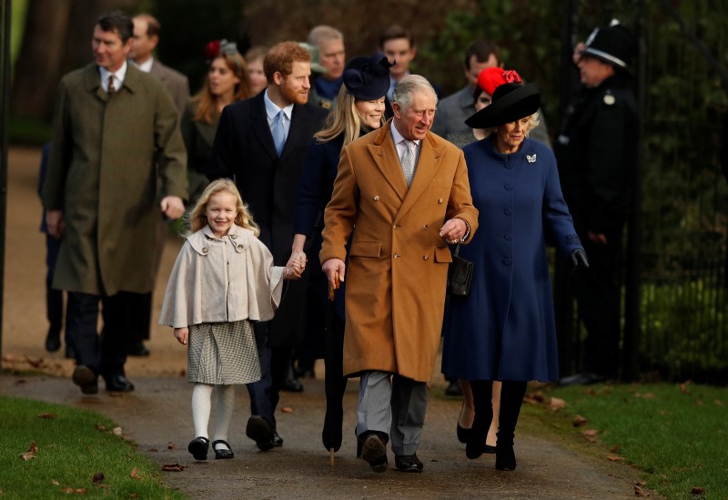 © Reuters. Britain's Prince Charles and his wife Camilla lead members of the royal family as they arrive to attend the Christmas Day church service in Sandringham