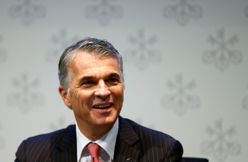 © Reuters. CEO Ermotti of Swiss bank UBS smiles before an annual news conference in Zurich